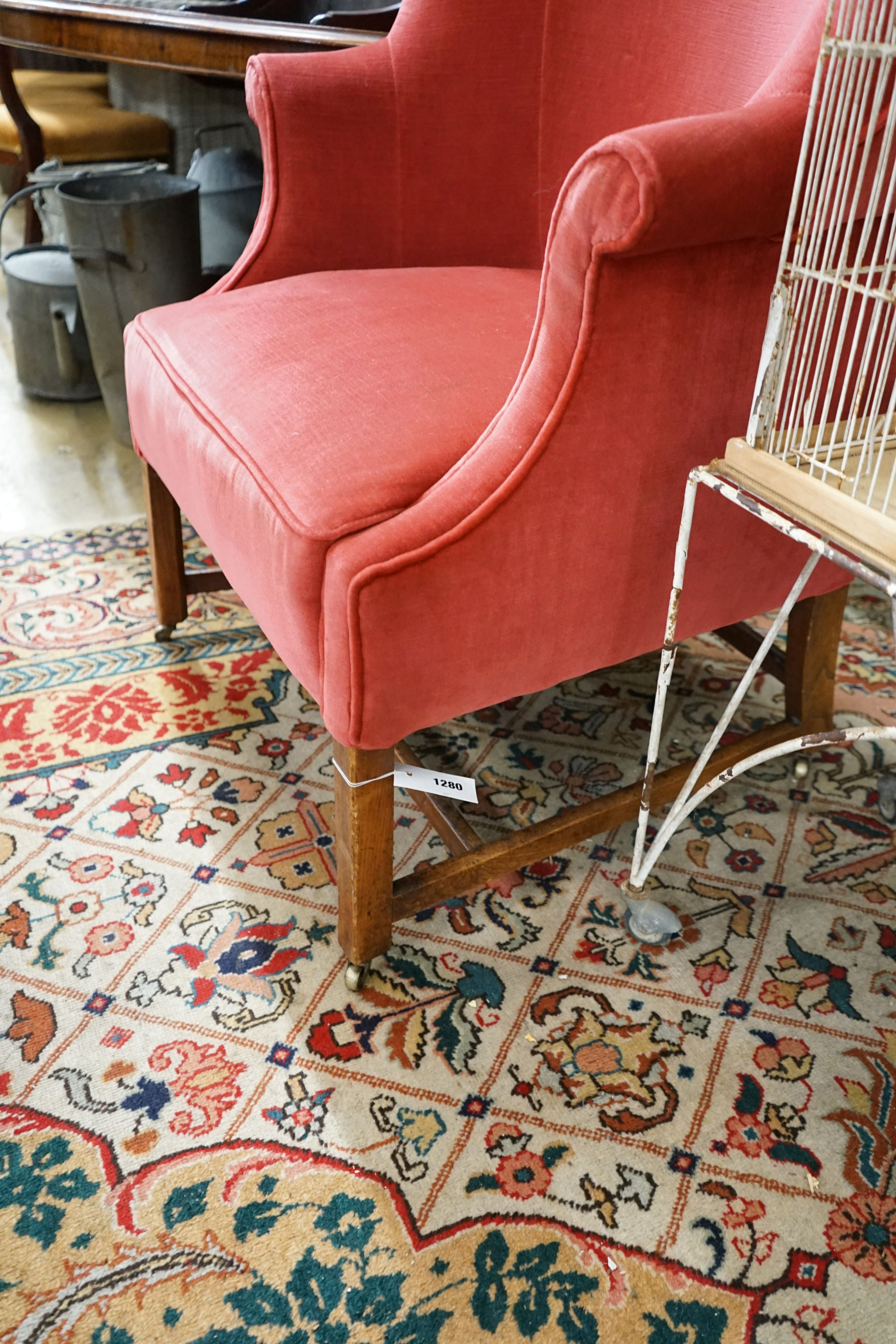 A George III provincial upholstered tub shaped armchair, width 76cm, depth 58cm, height 120cm